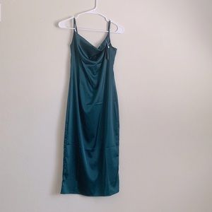 Teal, mid-length spaghetti strapped dress.